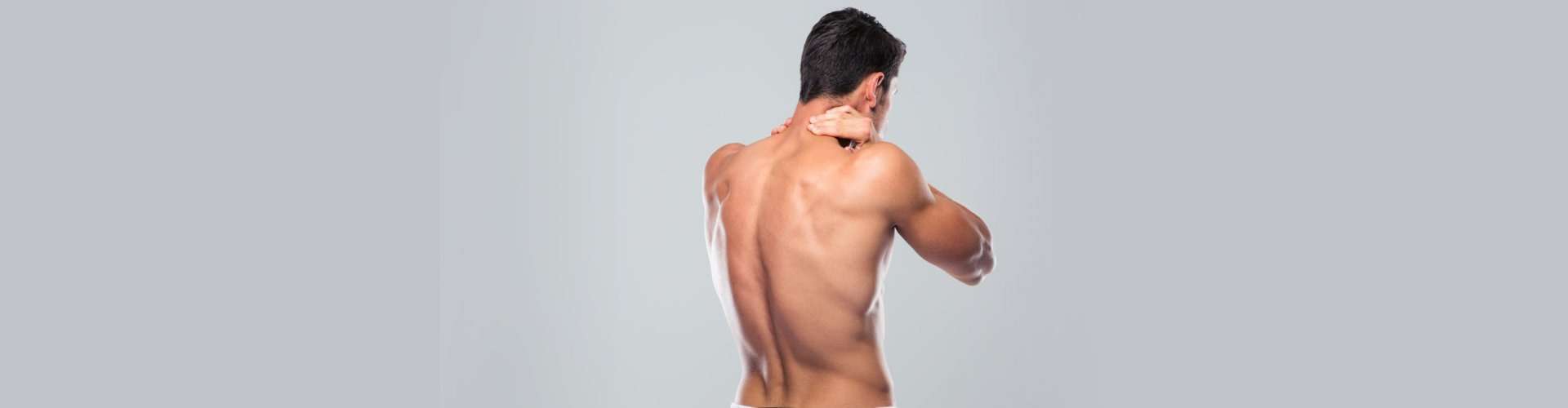 man massaging his neck